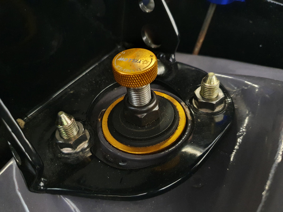 Exoracing titanium strut top nut fitted to Honda suspension tower