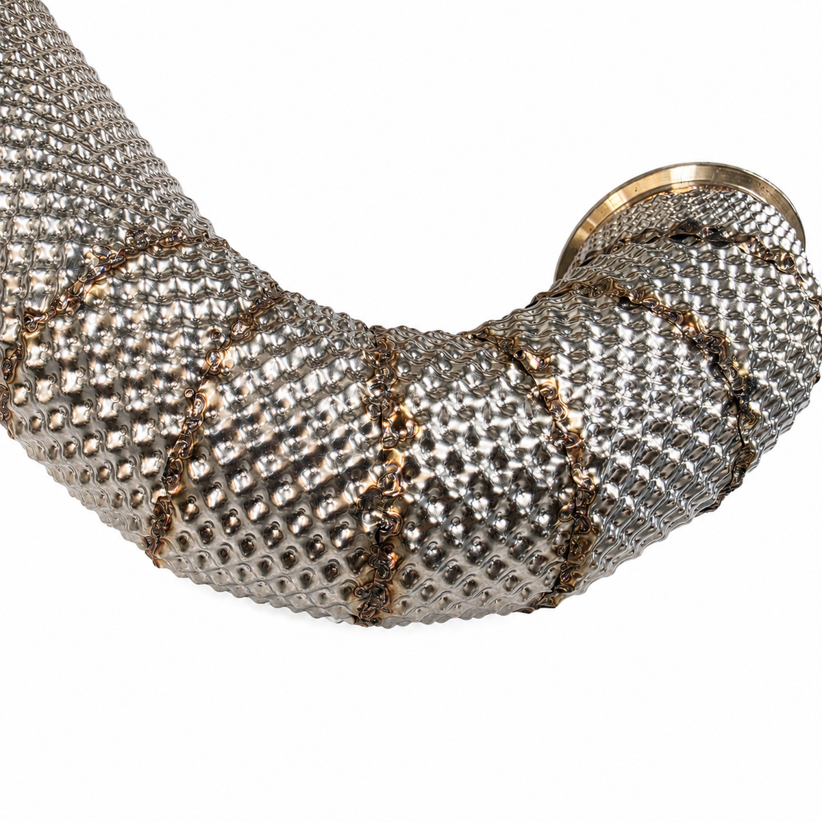 Close-up of overlapping stainless sections and welded seams on a completed custom exhaust heat shield
