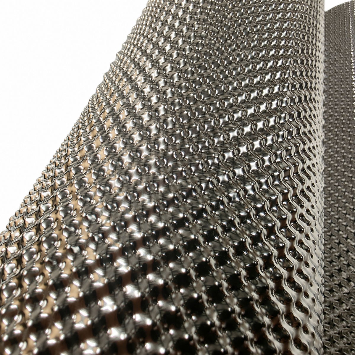 Close-up of the embossed surface texture of the stainless steel heat shield material
