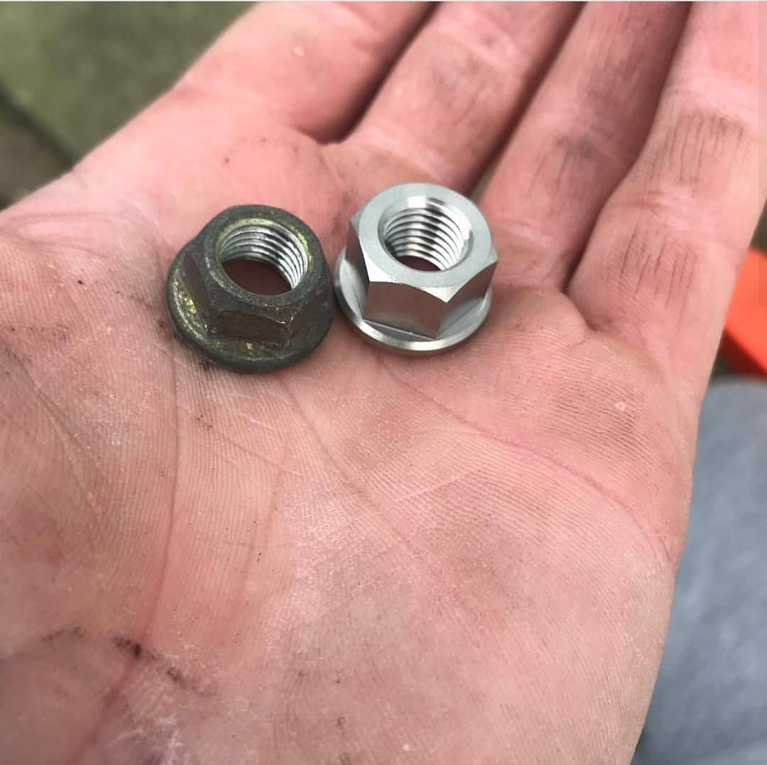 Exoracing titanium strut top nuts replacing rusty Honda OEM hardware